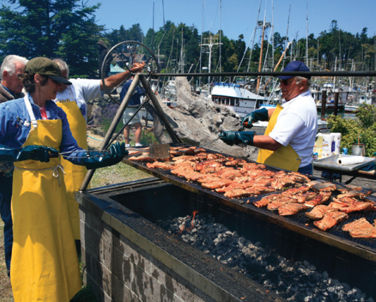 cooking salmon at the worlds largest salmon bbq